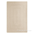 Tapis tressé en laine naturelle de couleur beige d'ivoire blanc